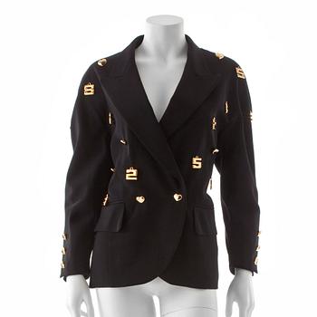 ESCADA, a black wool jacket with decor of gold colored numbers.