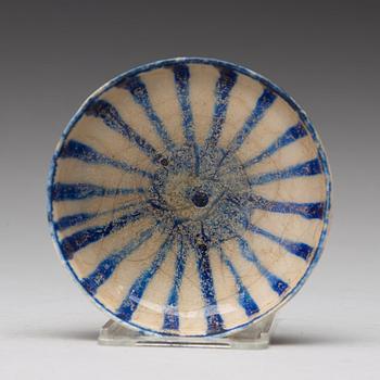 A BOWL, pottery with a white slip and underglaze blue decor, diameter ca 10 cm, Kashan, Persia/Iran early 13th century.