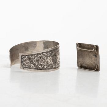 Two silver buttons, a belt buckle, an armring and a box, Persia, first part of the 1900s.