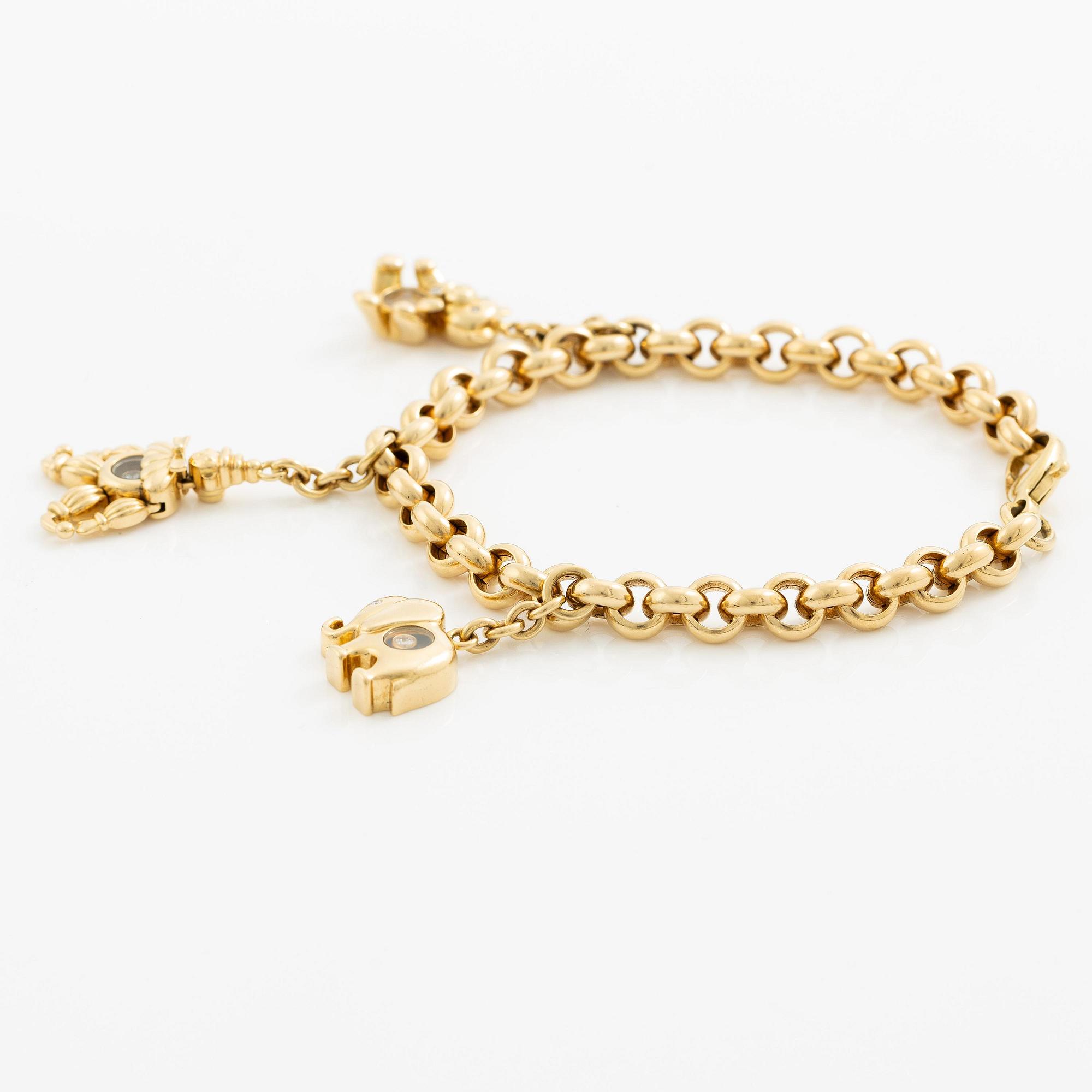 Chopard armband med berlocker 18K guld med runda briljantslipade diamanter.