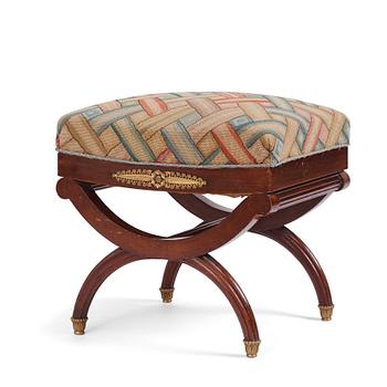 A French Empire-style mahogany stool, late 19th century.