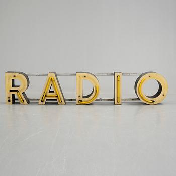 FASADSKYLT. "RADIO", 1900-talets första hälft.