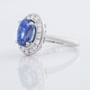 A sapphire and square cut diamond ring.