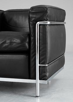 A pair of Le Corbusier 'LC 2' black leather and chromed steel easy chairs, Cassina, Italy.