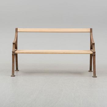 A late 19th century garden sofa by Byarum.