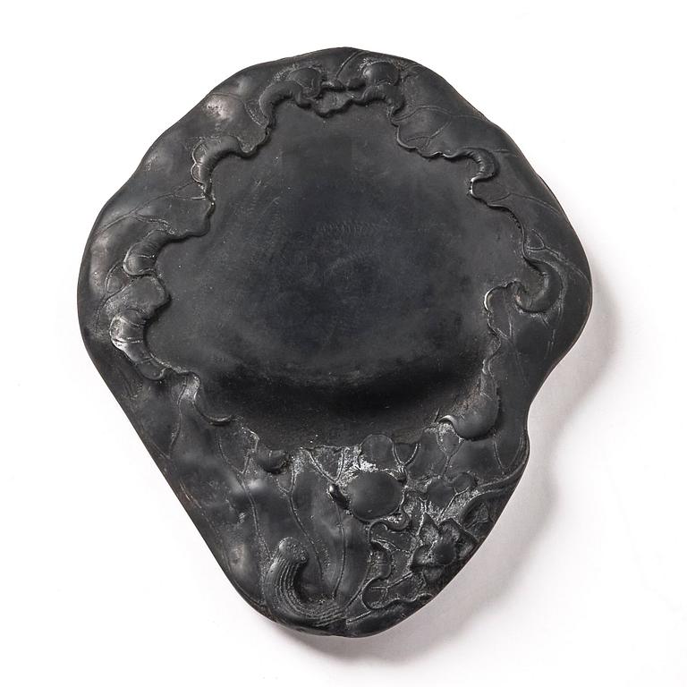 A lotus leaf shaped ink stone, Qing dynasty.