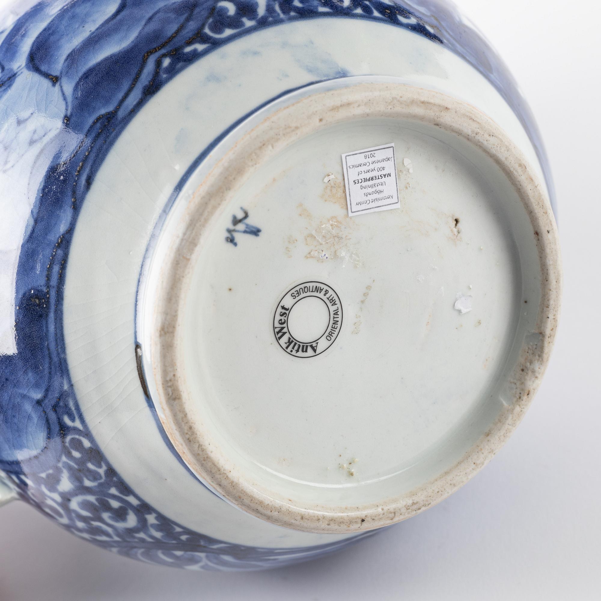 A large Japanese blue and white jug, 17th/18th Century.