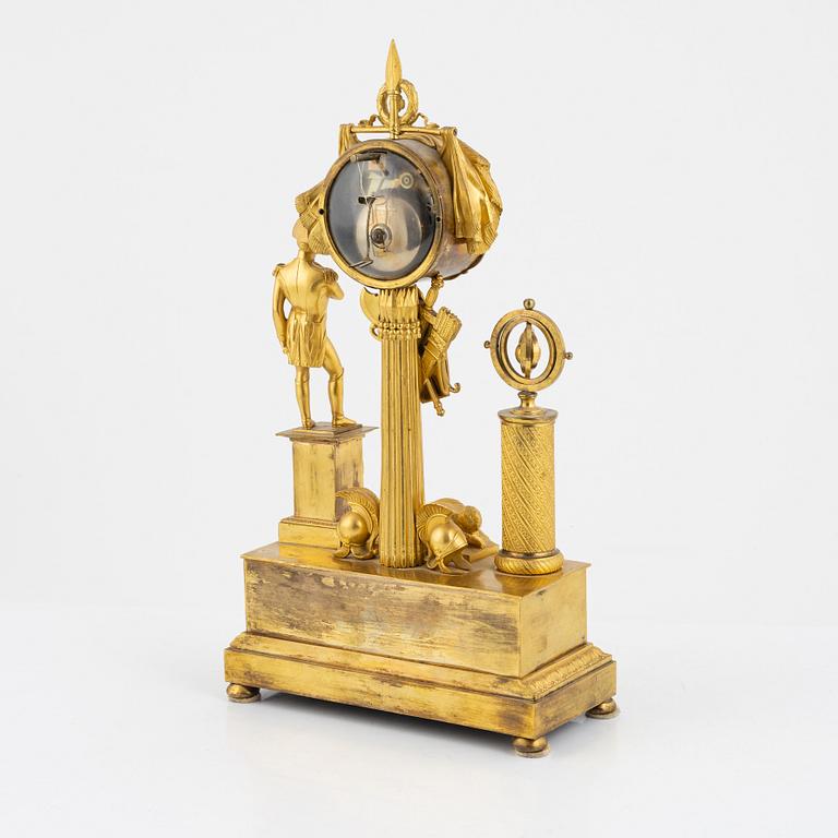 A French Empire ormolu figural mantel clock, early 19th century.