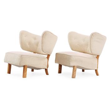 91. A pair of Nordic 1930's upholstered easy chairs, probably Denmark.