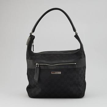 GUCCI, a canvas and leather bag.