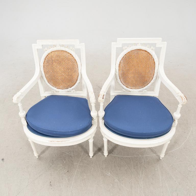 A pair of painted rattan Louis XVI style armchairs first half of the 20th century.