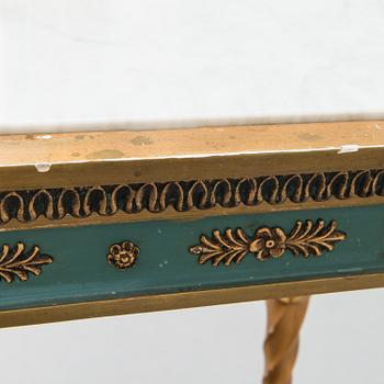 An early 20th century mirror with console table in late Gustavian style.