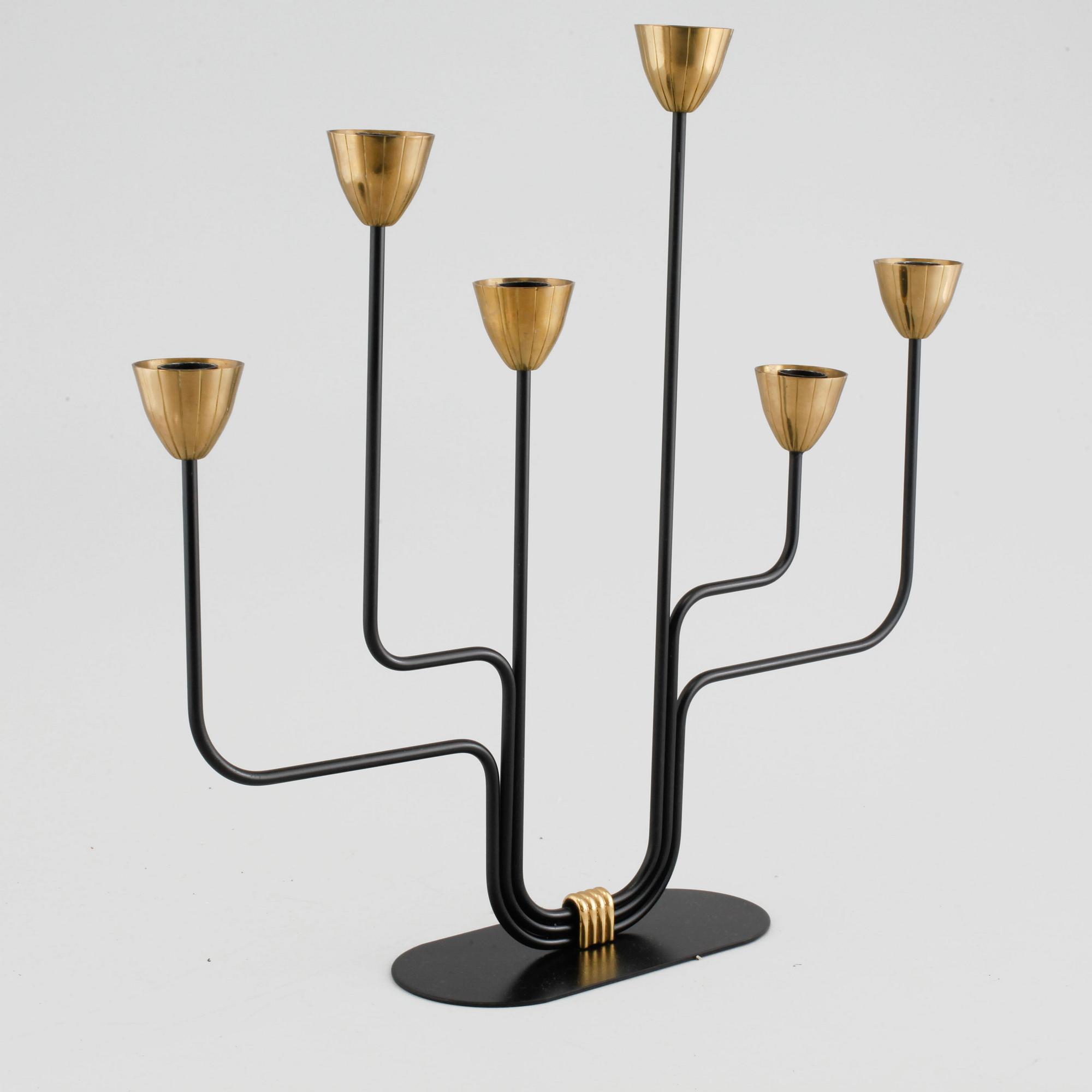 A candelabrum and one camdelstick by Gunnar Ander for Ystad Metall, 20th century.