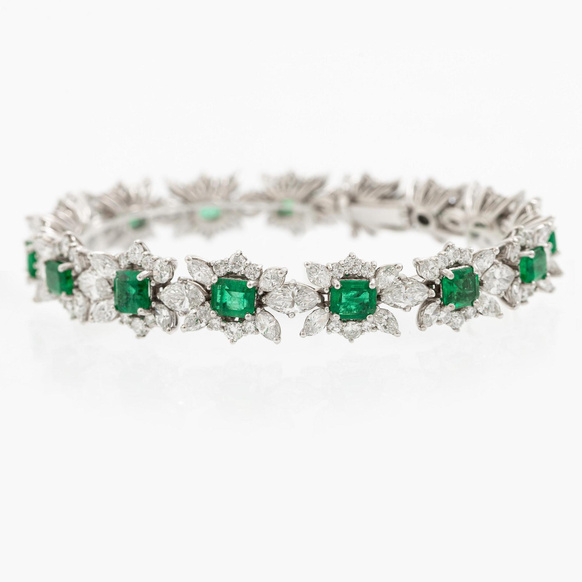 A bracelet in 18K white gold with step-cut emeralds and round and navette-shaped brilliant-cut diamonds.