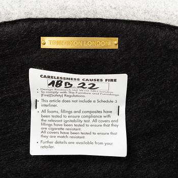 A 'Wingback Micro' easy chair by Tom Dixon.