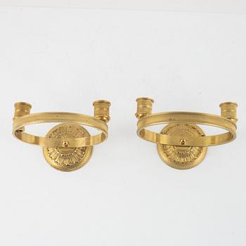 A pair of Empire-style gilt bronze two-light wall lights, 20th century.