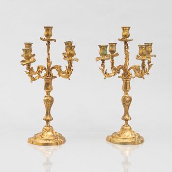 A pair of rococo style candelabras, around 1900.