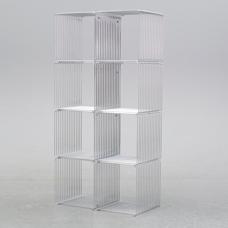 A 'Panton wire' shelving system by Verner Panton for Montana.