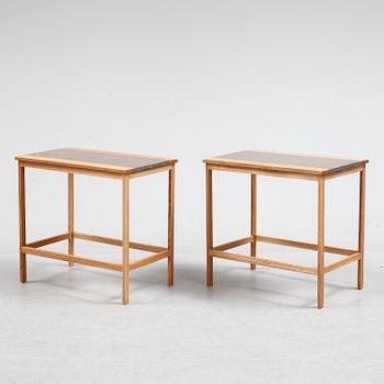 A pair of of oak and limestone tables, 21th century.