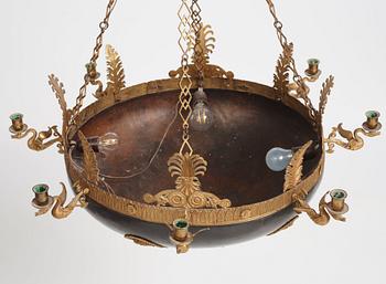 A presumably Russian Empire gilt and patinated bronze nine-branch chandelier, 19th century.