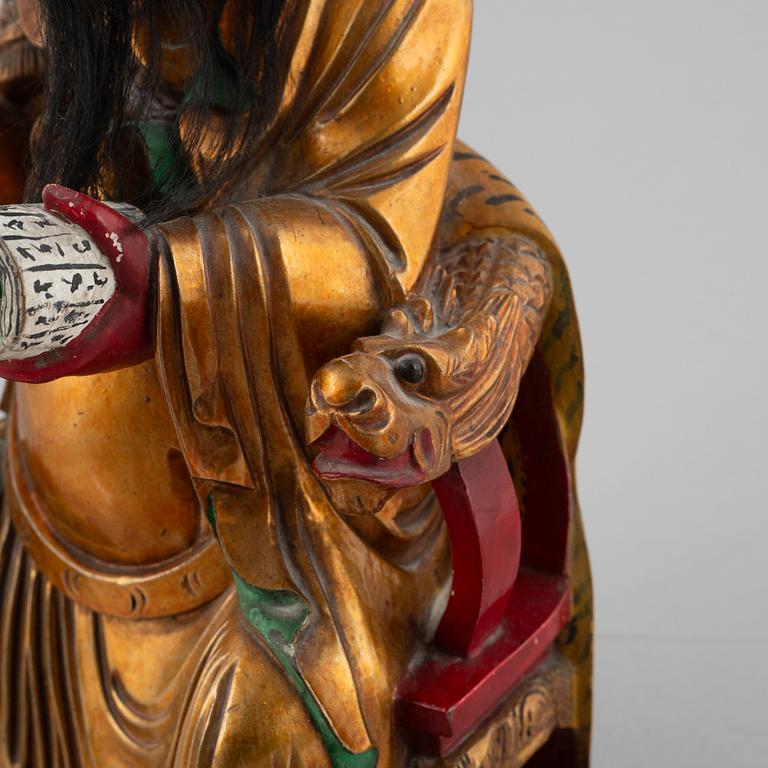 A Chinese lacquered wood figure, 20th century.