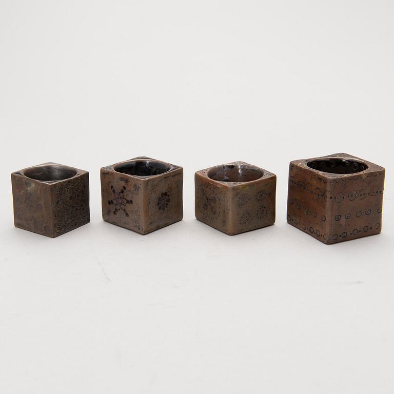 Four stoneware cruets, signed Bryk.