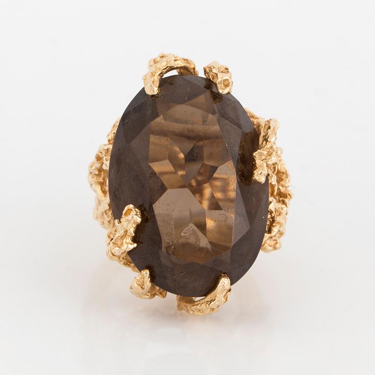 A smoky quartz cocktail ring.