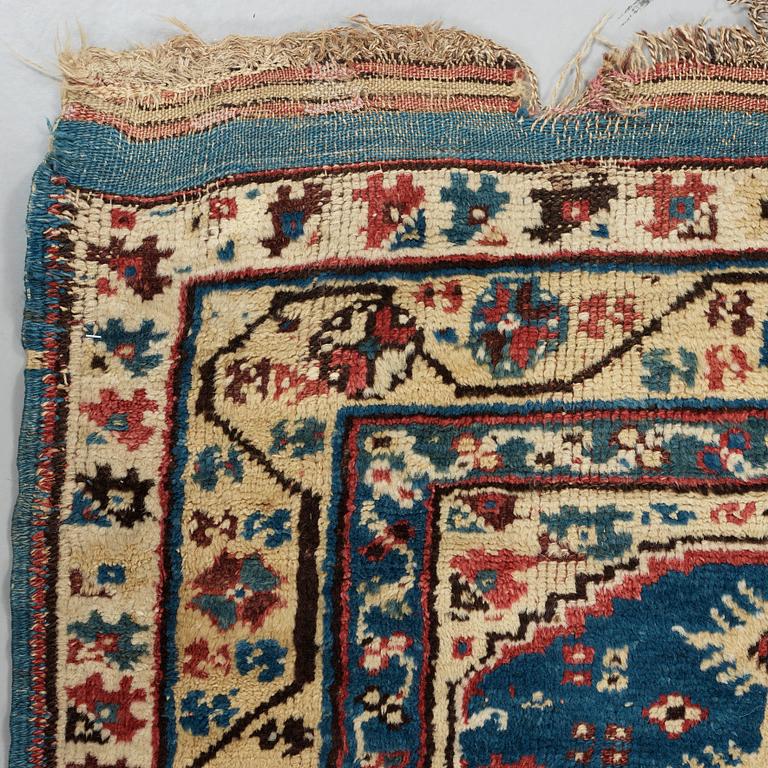 A RUG. An antique Anatolian, probably Megri. 185,5 x 137 cm (as well as one end with six cm flat weave).