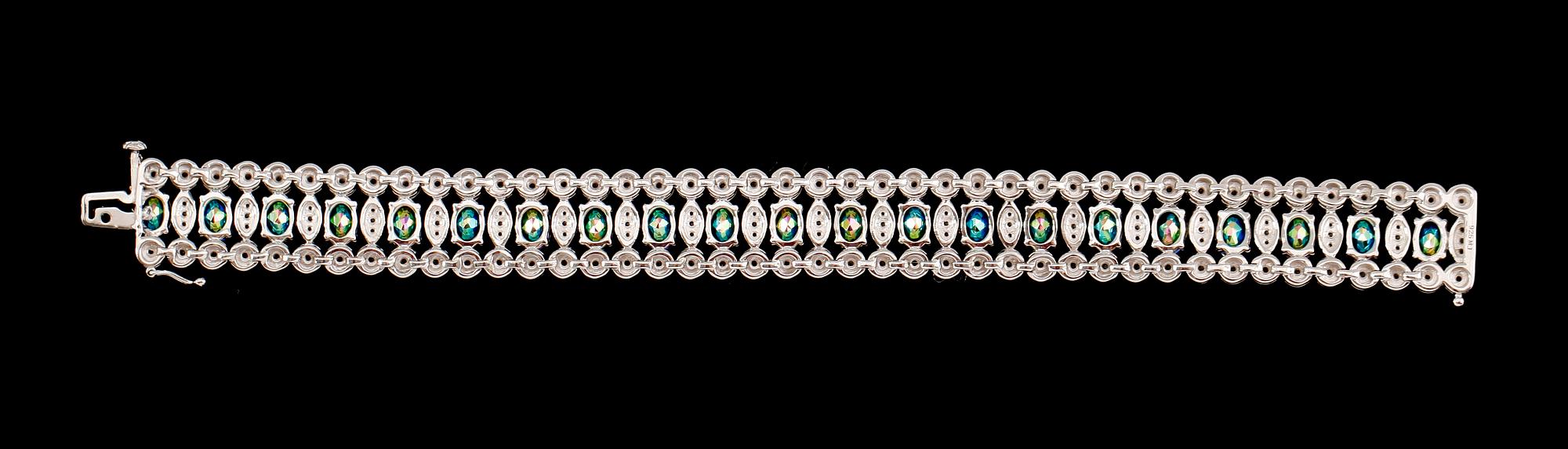 ARMBAND, sterlingsilver, vita och färgade topaser tot ca 25.00 ct.