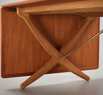 Hans J. Wegner, a teak, beech and brass dining table by Andreas Tuck, "AT-314", Denmark 1950-60's.