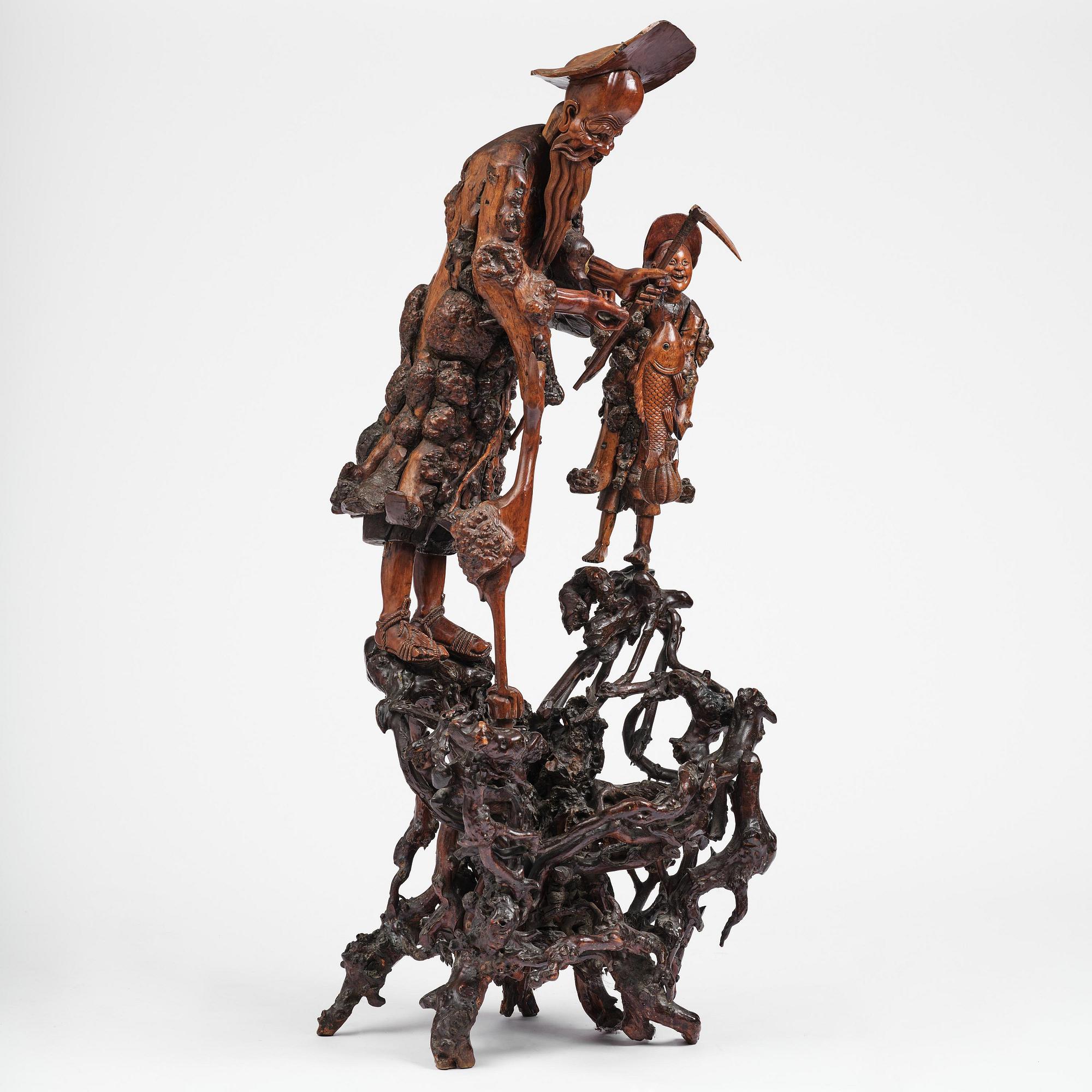 A large well sculptured root sculpture of 'Sholau and attendant', late Qing dynasty, 19th century.