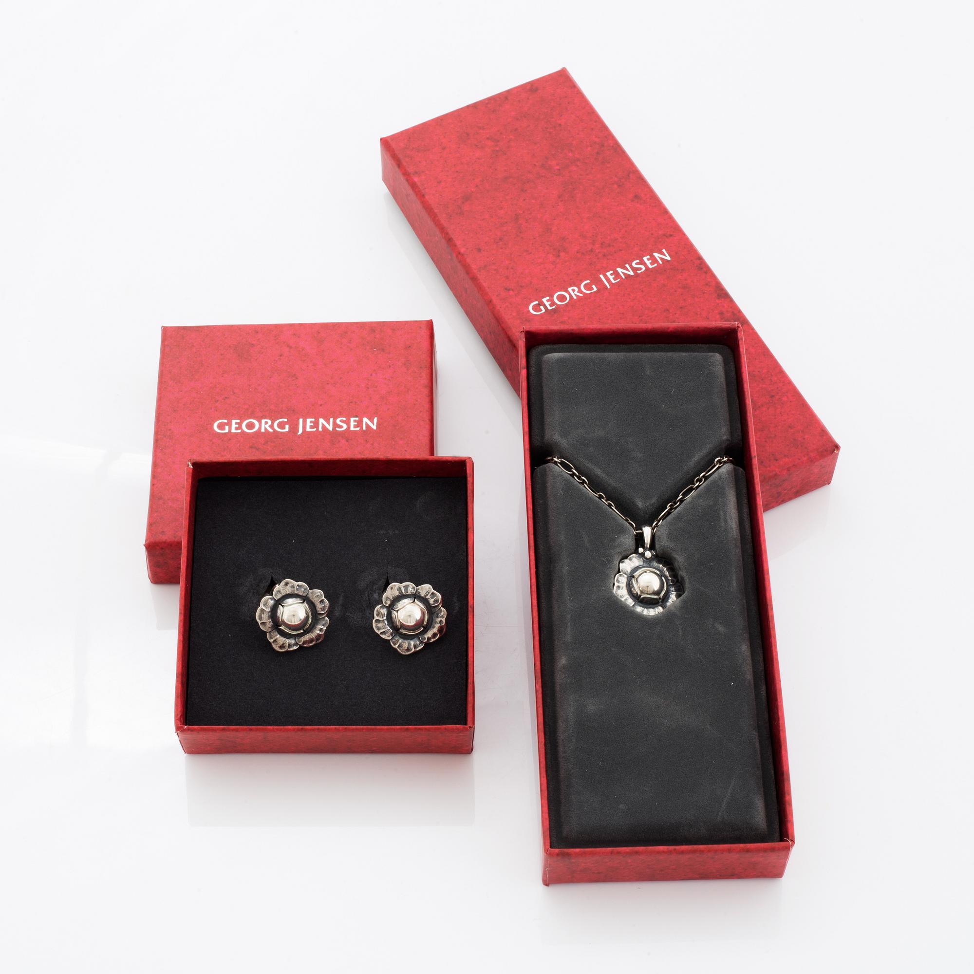 Georg Jensen Heritage silver a pair of earrings and a necklace.