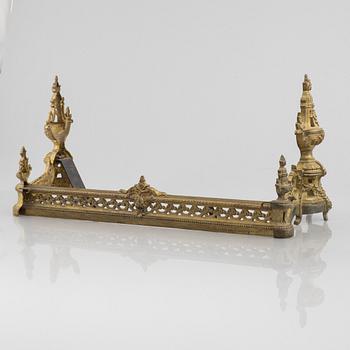 A pair of Louis XVI-style bronze andirons, France, later part of the 19th century.