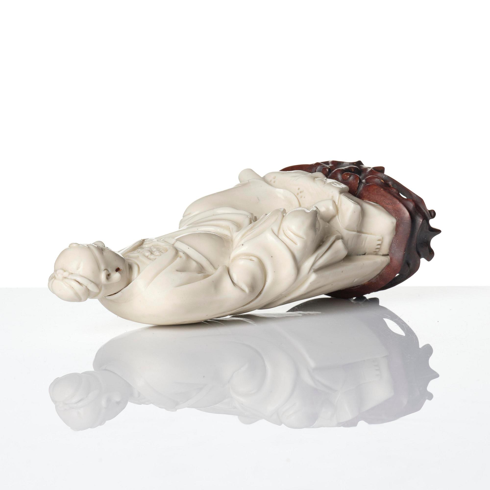 A blanc de chine figure of Guandi, Qing dynasty, 18th century.