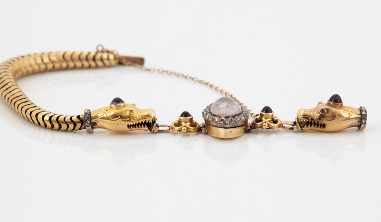 An 18K gold bracelet set with amethysts and old-cut diamonds.