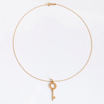 Tiffany & Co, an 18K gold 'Atlas Key' pendant with chain.