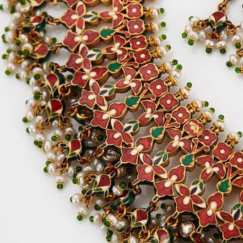 An Indian demi parure comprising a necklace and a pair of earrings.