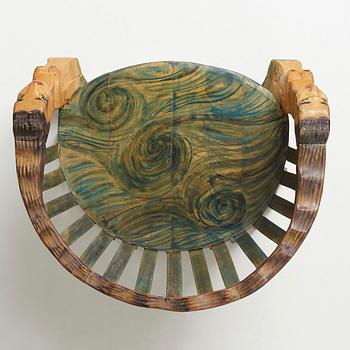 Gérard Rigot, a sculptured and signed armchair, late 20th century.