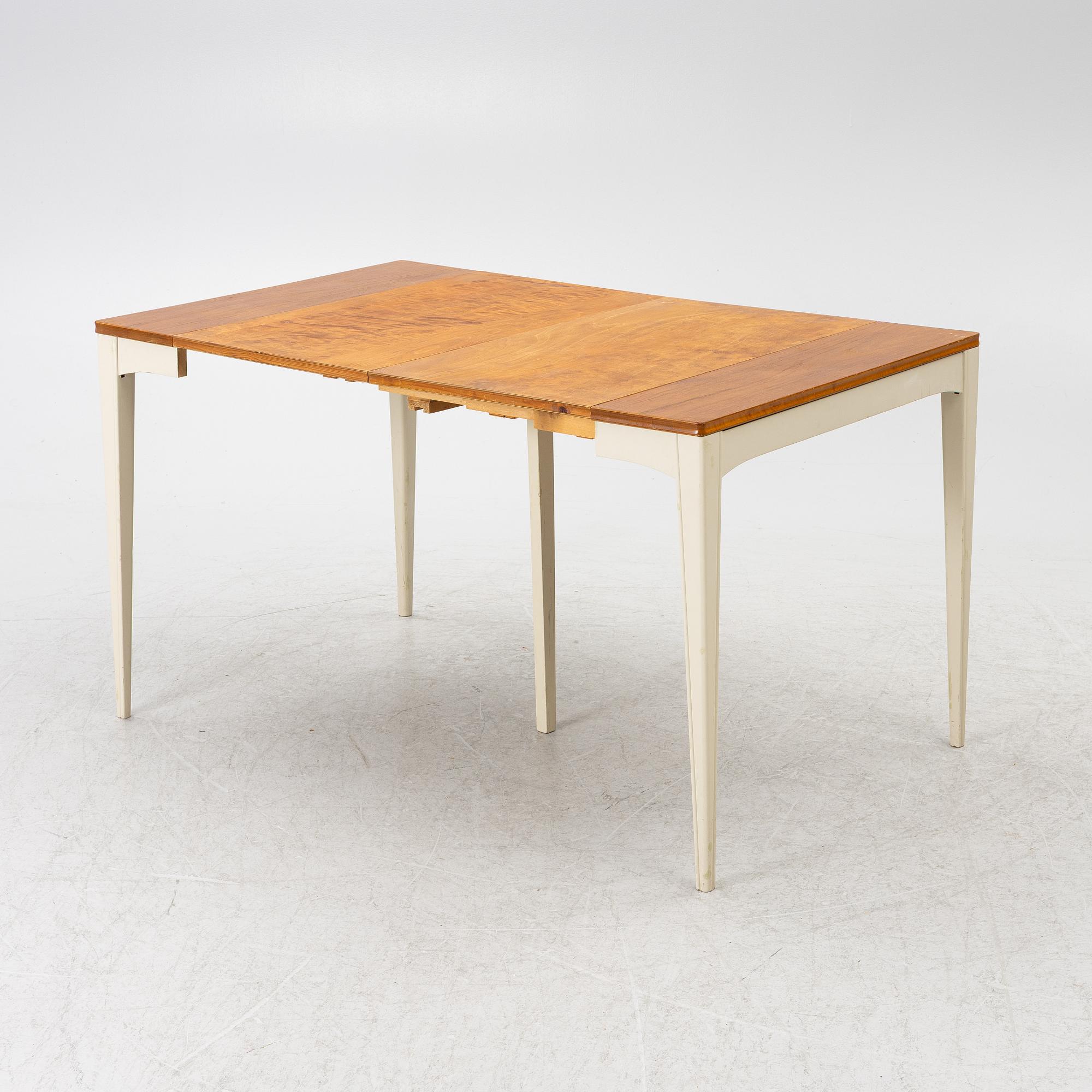 A dining table, mid-20th century.