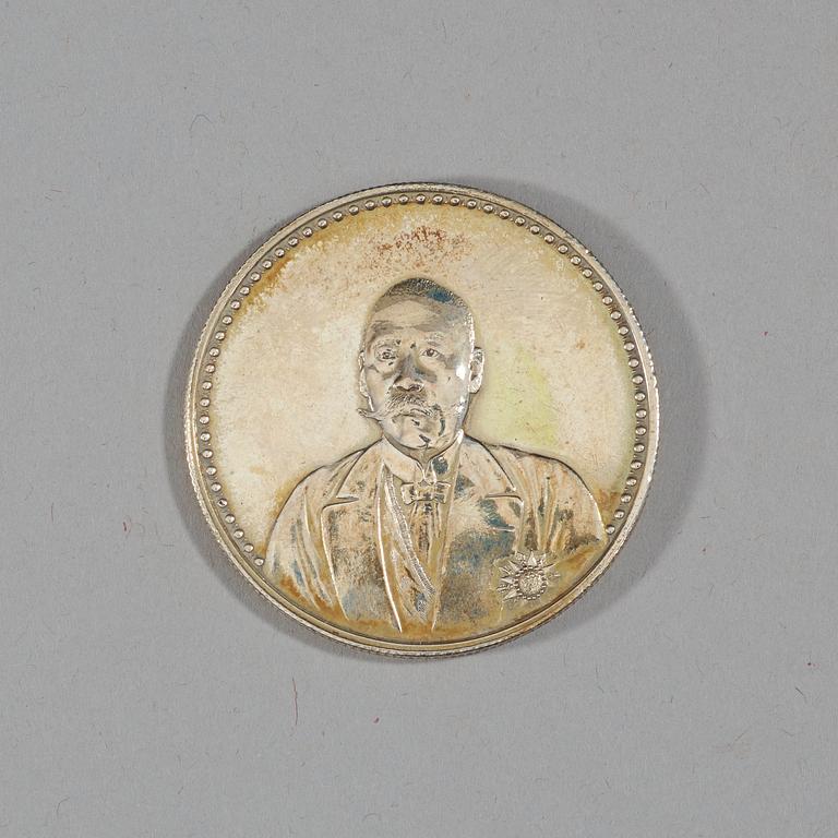 A box with five silver coins, Republic, early 20th Century.
