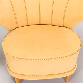 A pair of mid-20th century armchairs.