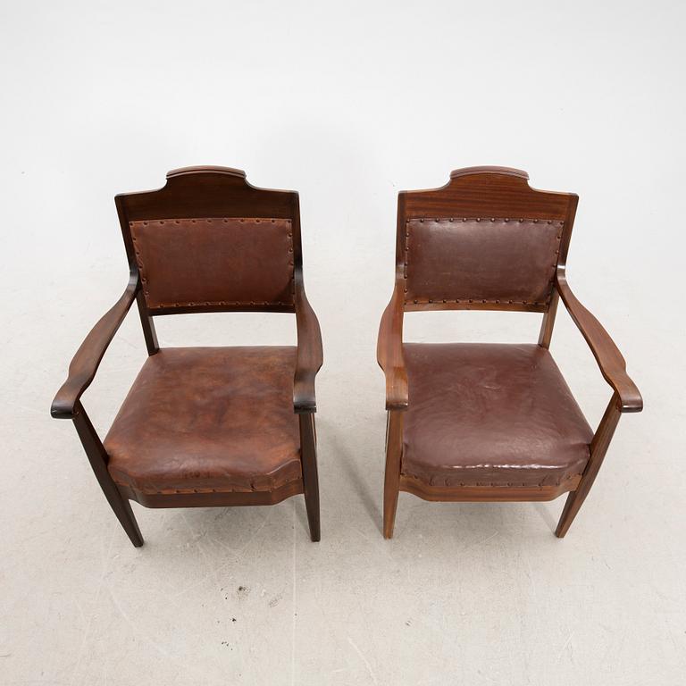 A pair of early 1900s armchairs.