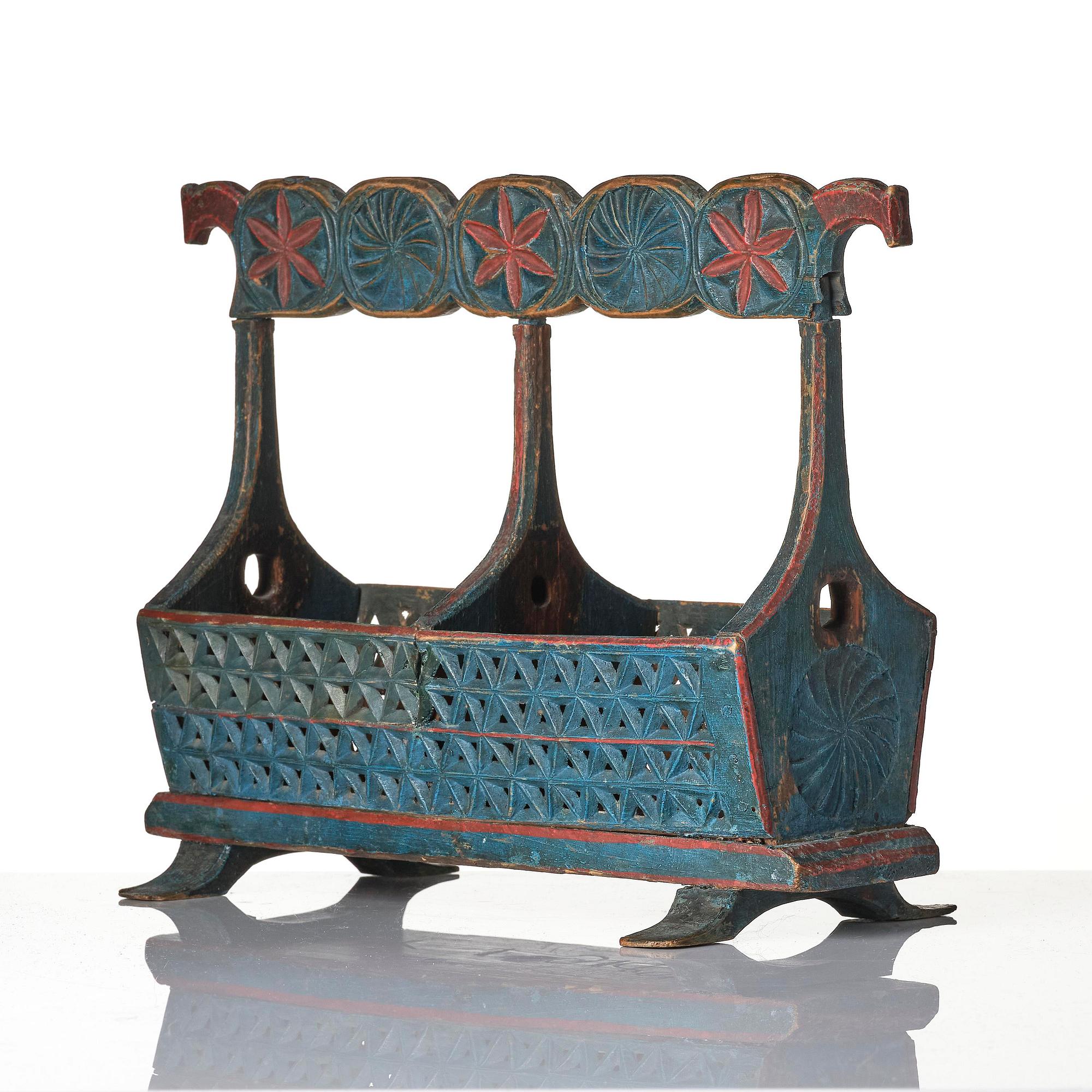 A Swedish folk art carved and painted bobin-holder, circa 1800.