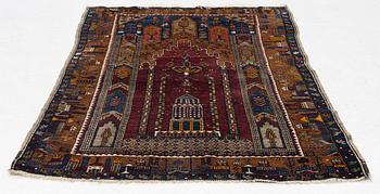 An antique rug, possibly Anatolian, approx. 170 x 102 cm.