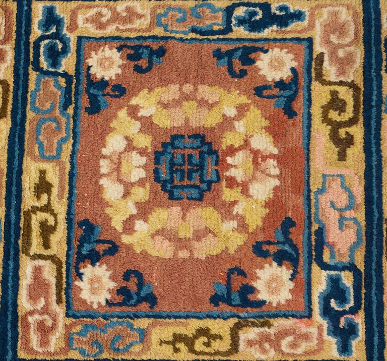 A MEDITATION RUG, three squares, an antique Ningxia, China, the Qing dynasty, ca 166 x 58,5 cm.