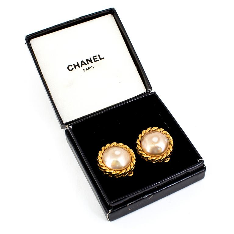 A pair of clips by Chanel.