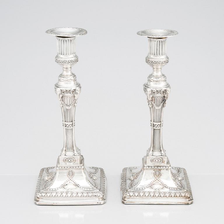 An English pair of 18th Century silver candlesticks, mark of John Winter & Co, Sheffield 1775.