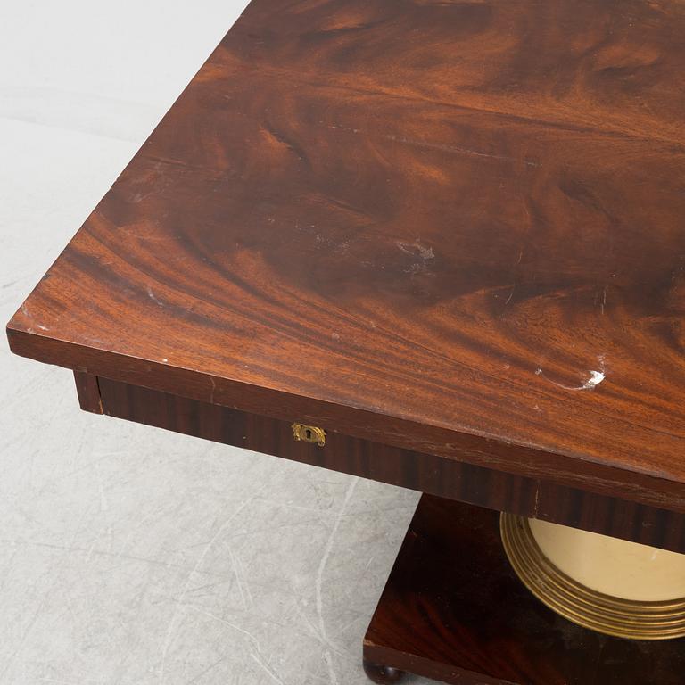 An Empire style library table, first half of the 20th century.