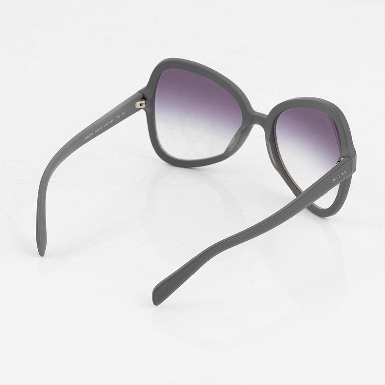 Prada, A pair of grey sunglasses.