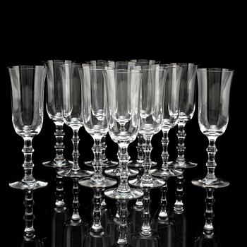 A set of twelve champagne glasses by Simon Gate.